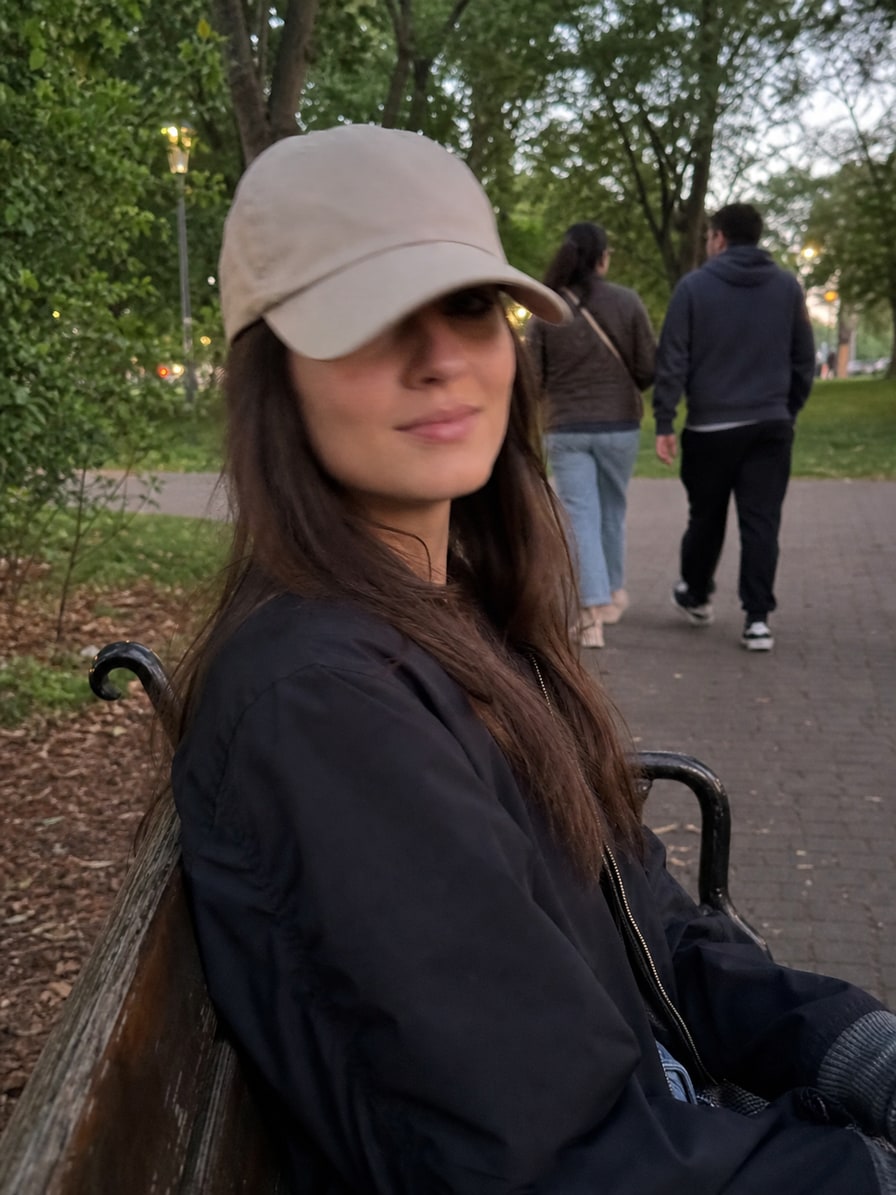 Example park photo with a cap and people in the background